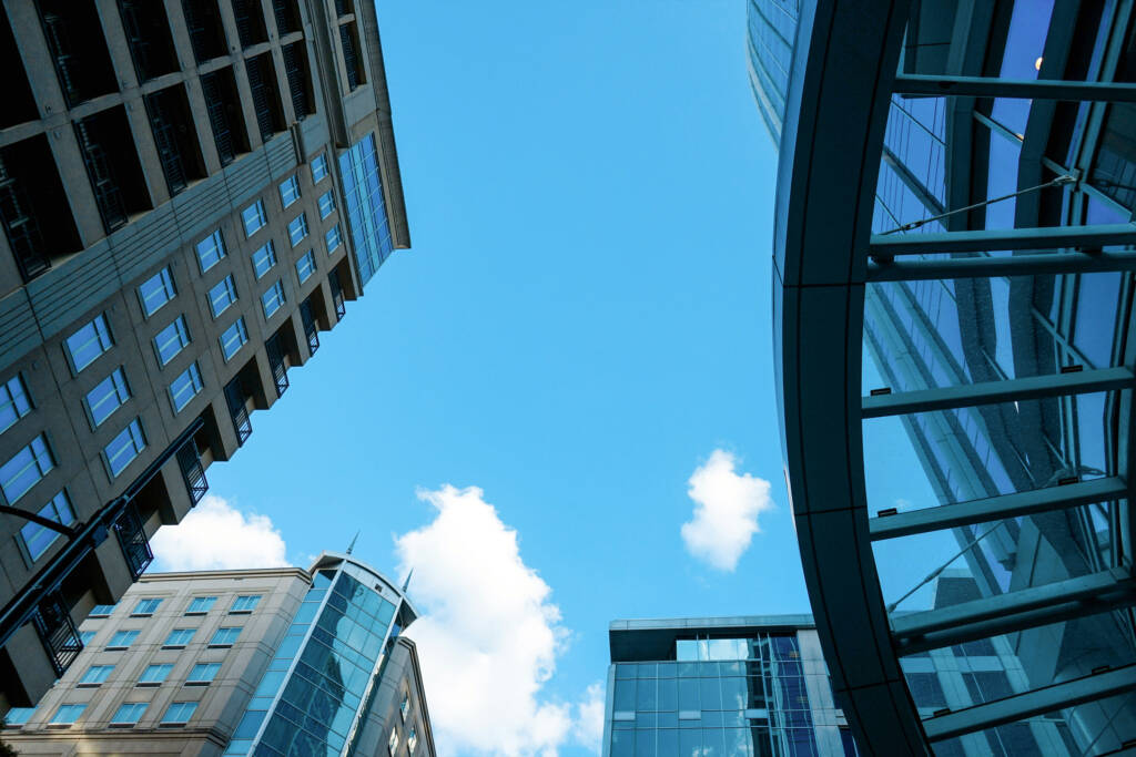 Buildings and the bright blue sky.